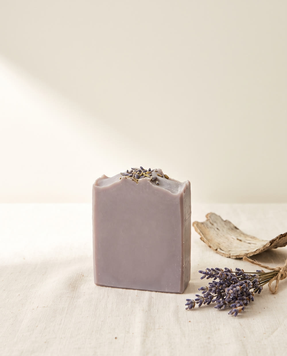 Lavender and Oak bar with dried lavender buds and a piece of oak bark